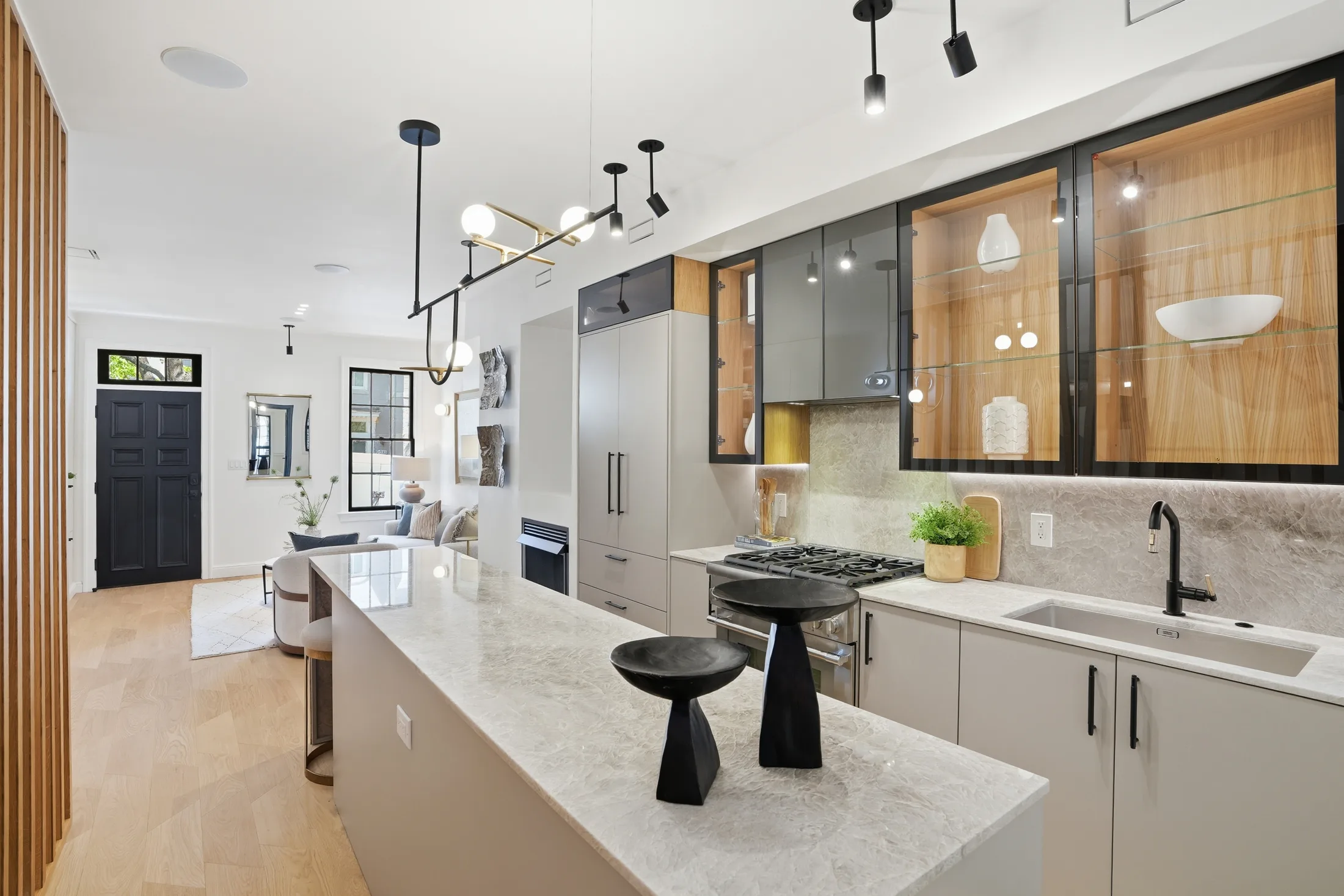 Kitchen with Sicilian millwork and smoked glass cabinetry at Casa Ulivo